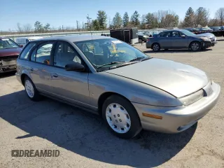 1997 Saturn SW z VIN 1G8ZK8274VZ194085, wystawiony jako Copart lot #50230135 z przebiegiem 211 051 mil mil oraz Szkody całkowita. Historia ofert i sprzedaży dostępna na DreamBid. Obrazek 4.
