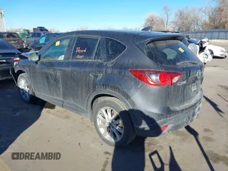 2014 Mazda CX-5 Grand Touring with VIN JM3KE2DY1E0421326, listed as a IAAI auction lot 41330794 with 127,589 mi miles. Bid and sale history available at carsss.com. Image 3.