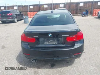 2014 BMW 3 Series 328i xDrive with VIN WBA3B3C56EJ981322, listed as a IAAI auction lot 42104530 with 104,376 mi miles. Bid and sale history available at carsss.com. Image 16.