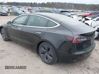 2019 Tesla Model 3 Mid Range with VIN 5YJ3E1EA5KF297213, listed as a IAAI auction lot 41361412 with 93,801 mi miles and . Bid and sale history available at carsss.com. Image 3.