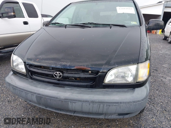 1998 Toyota Sienna LE with VIN 4T3ZF13C6WU016001, listed as a IAAI auction lot 42604162 with 214,491 mi miles and . Bid and sale history available at DreamBid. Image 13.