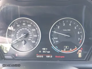 2017 BMW X1 xDrive28i with VIN WBXHT3C30H5F68187, listed as a IAAI auction lot 41830892 with 101,313 mi miles. Bid and sale history available at carsss.com. Image 7.