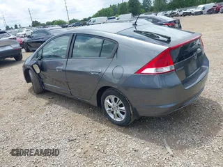 2010 Honda Insight EX with VIN JHMZE2H71AS008487, listed as a IAAI auction lot 42533409 with 95,765 mi miles and . Bid and sale history available at DreamBid. Image 3.