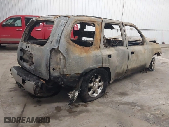 2005 GMC Envoy SLT z VIN 1GKDT13S752254350, wystawiony jako IAAI lot #41301432 z przebiegiem Nie podano mil oraz . Historia ofert i sprzedaży dostępna na DreamBid. Obrazek 4.