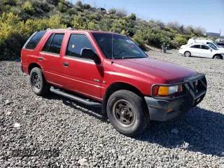 1997 Isuzu Rodeo z VIN 4S2CM58V0V4337626, wystawiony jako Copart lot #55491015 z przebiegiem 163 499 mil mil oraz Tytuł czysty. Historia ofert i sprzedaży dostępna na DreamBid. Obrazek 4.