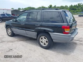 2002 Jeep Grand Cherokee Laredo with VIN 1J4GX48S22C226527, listed as a IAAI auction lot 42630457 with 197,333 mi miles and . Bid and sale history available at DreamBid. Image 3.