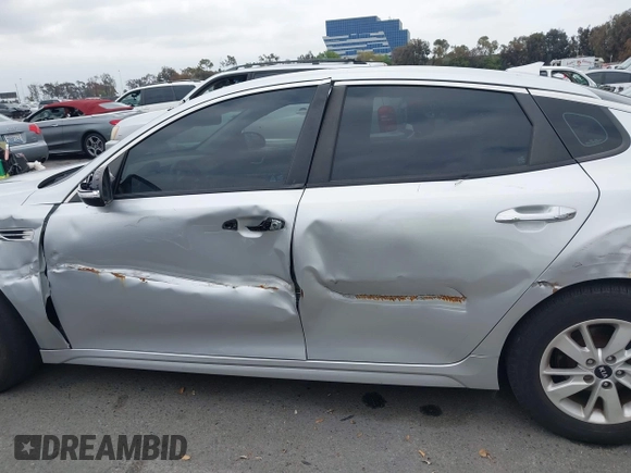 2016 Kia Optima LX with VIN 5XXGT4L34GG023812, listed as a IAAI auction lot 42034160 with 96,720 mi miles and . Bid and sale history available at DreamBid. Image 14.