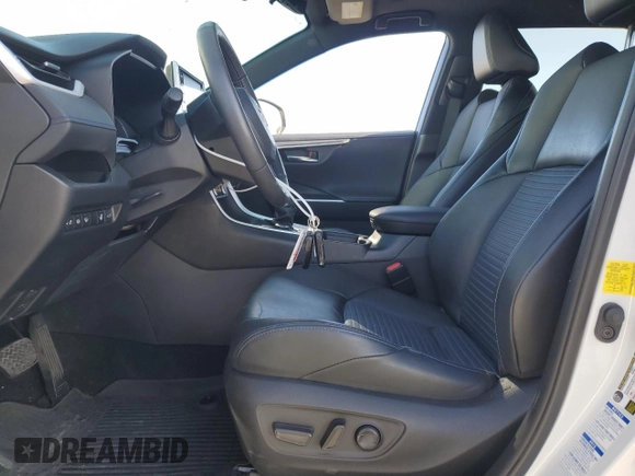 2021 Toyota RAV4 Hybrid XSE with VIN 2T3E6RFV1MW018990, listed as a Copart auction lot 64043865 with 55,938 mi miles and Salvage title. Bid and sale history available at DreamBid. Image 7.