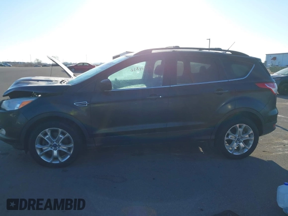 2013 Ford Escape SE with VIN 1FMCU9GX2DUC24504, listed as a IAAI auction lot 41846714 with 145,333 mi miles. Bid and sale history available at carsss.com. Image 14.