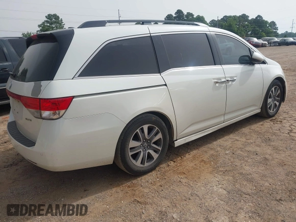 2015 Honda Odyssey Touring Elite with VIN 5FNRL5H96FB045968, listed as a IAAI auction lot 42263637 with 207,637 mi miles and . Bid and sale history available at DreamBid. Image 4.