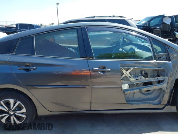 2018 Toyota Prius Plus with VIN JTDKARFP0J3101473, listed as a IAAI auction lot 41857956 with 110,020 mi miles and . Bid and sale history available at DreamBid. Image 14.