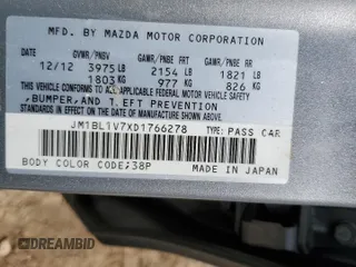 2013 Mazda 3 i Touring z VIN JM1BL1V7XD1766278, wystawiony jako Copart lot #60024815 z przebiegiem 143 490 mil mil oraz Szkoda całkowita • Salvage title. Historia ofert i sprzedaży dostępna na DreamBid. Obrazek 13.
