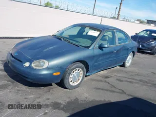 1996 Ford Taurus LX with VIN 1FALP53S0TG125665, listed as a IAAI auction lot 42290691 with 91,152 mi miles and . Bid and sale history available at DreamBid. Image 12.