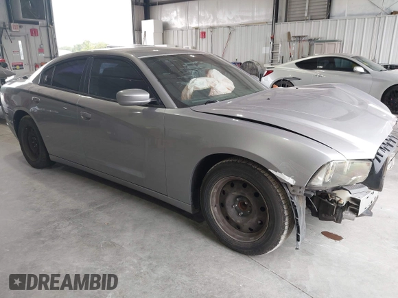 2013 Dodge Charger SE with VIN 2C3CDXBG7DH601545, listed as a IAAI auction lot 40332328 with 162,992 mi miles. Bid and sale history available at carsss.com. Image 1.