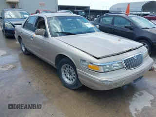 1997 Mercury Grand Marquis LS z VIN 2MELM75W3VX613339, wystawiony jako IAAI lot #42386327 z przebiegiem 245 668 mil mil oraz . Historia ofert i sprzedaży dostępna na DreamBid. Obrazek 1.
