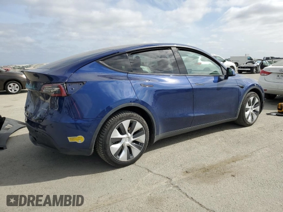 2021 Tesla Model Y Long Range with VIN 5YJYGDEEXMF192447, listed as a Copart auction lot 53550055 with 65,673 mi miles and Salvage Title. Bid and sale history available at DreamBid. Image 3.