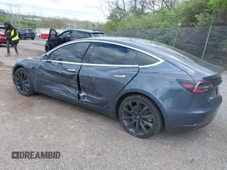2020 Tesla Model 3 Long Range with VIN 5YJ3E1EB2LF646449, listed as a IAAI auction lot 42059086 with 120,981 mi miles and . Bid and sale history available at DreamBid. Image 3.