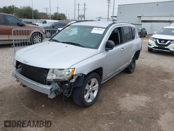 2011 Jeep Compass with VIN 1J4NT1FA7BD142600, listed as a IAAI auction lot 41590661 with 266,600 mi miles. Bid and sale history available at carsss.com. Image 19.