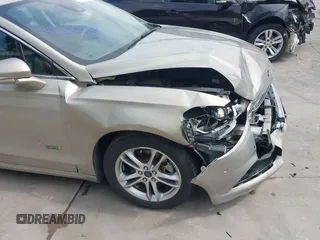 2015 Ford Fusion Energi Titanium with VIN 3FA6P0SU3FR114739, listed as a IAAI auction lot 42003011 with 120,553 mi miles. Bid and sale history available at carsss.com. Image 17.