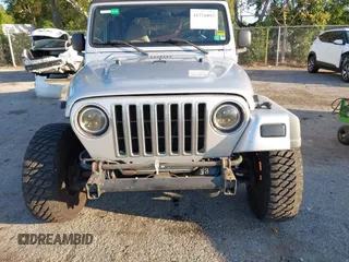 2005 Jeep Wrangler Unlimited with VIN 1J4FA44S65P335444, listed as a IAAI auction lot 41731093 with 143,918 mi miles. Bid and sale history available at carsss.com. Image 6.