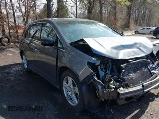 2012 Honda Odyssey Touring with VIN 5FNRL5H97CB073449, listed as a IAAI auction lot 41821884 with 132,153 mi miles. Bid and sale history available at carsss.com. Image 1.