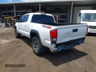 2018 Toyota Tacoma SR5 with VIN 3TMDZ5BN5JM048038, listed as a IAAI auction lot 42084922 with 79,718 mi miles and . Bid and sale history available at DreamBid. Image 6.