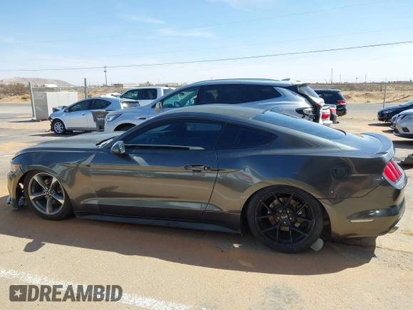2015 Ford Mustang V6 with VIN 1FA6P8AM5F5318400, listed as a IAAI auction lot 41812625 with 97,728 mi miles and . Bid and sale history available at DreamBid. Image 14.