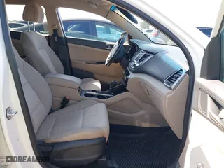 2017 Hyundai Tucson Value with VIN KM8J33A27HU438902, listed as a IAAI auction lot 41835502 with 84,885 mi miles. Bid and sale history available at carsss.com. Image 5.