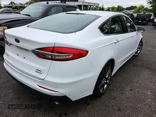 2020 Ford Fusion SEL z VIN 3FA6P0CD1LR264990, wystawiony jako IAAI lot #42559281 z przebiegiem 84 460 mil mil oraz . Historia ofert i sprzedaży dostępna na DreamBid. Obrazek 1.