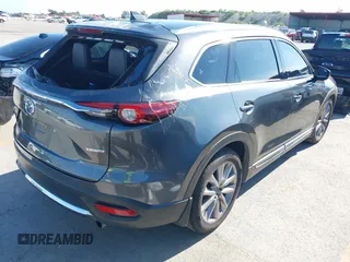 2020 Mazda CX-9 Grand Touring with VIN JM3TCADY1L0417651, listed as a IAAI auction lot 42334867 with 105,236 mi miles and . Bid and sale history available at DreamBid. Image 4.