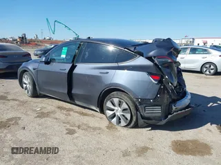 2023 Tesla Model Y Long Range with VIN 7SAYGAEE8PF667728, listed as a IAAI auction lot 41839771 with 32,654 mi miles and . Bid and sale history available at DreamBid. Image 3.