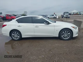2015 Infiniti Q50 Premium z VIN JN1BV7AR6FM402481, wystawiony jako IAAI lot #41957004 z przebiegiem 171 913 mil mil oraz . Historia ofert i sprzedaży dostępna na DreamBid. Obrazek 13.