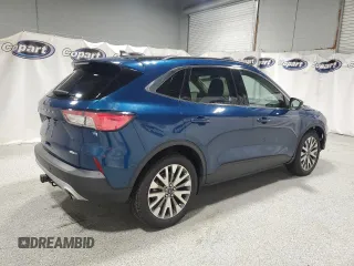 2020 Ford Escape Titanium z VIN 1FMCU9J98LUA93393, wystawiony jako Copart lot #65366925 z przebiegiem 74 750 mil mil oraz Czysty tytuł • Clean title. Historia ofert i sprzedaży dostępna na DreamBid. Obrazek 3.