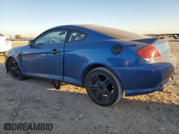 2005 Hyundai Tiburon GT z VIN KMHHN65F35U186438, wystawiony jako Copart lot #41879955 z przebiegiem 152 574 mil mil oraz Szkoda całkowita • Salvage title. Historia ofert i sprzedaży dostępna na DreamBid. Obrazek 2.