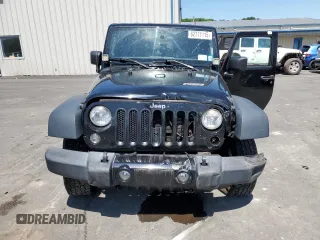 2014 Jeep Wrangler Sport with VIN 1C4AJWAG2EL113843, listed as a Copart auction lot 62771115 with 70,089 mi miles and Salvage title. Bid and sale history available at DreamBid. Image 5.