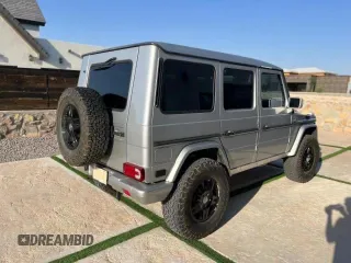 2002 Mercedes-Benz G-Class with VIN WDCYR49EX2X128555, listed as a Copart auction lot 77047164 with 222,979 mi miles and Salvage Title. Bid and sale history available at carsss.com. Image 4.