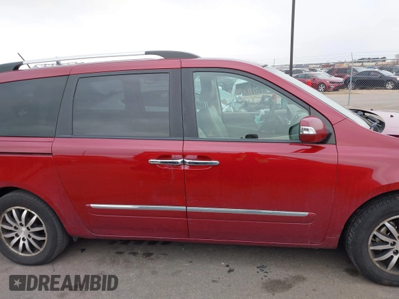 2012 Kia Sedona EX with VIN KNDMH4C76C6463143, listed as a IAAI auction lot 41990970 with 214,045 mi miles. Bid and sale history available at carsss.com. Image 13.