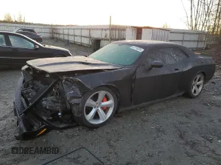 2010 Dodge Challenger SRT-8 with VIN 2B3CJ7DW8AH104011, listed as a Copart auction lot 87216334 with 55,519 mi miles and Salvage title. Bid and sale history available at DreamBid. Image 1.