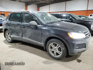 2013 Volkswagen Touareg Sport с VIN WVGEP9BP5DD008301, выставлен на аукционе Copart как лот 85085984 с пробегом 204 735 миль миль и Списание • Salvage title. История ставок и продаж доступна на DreamBid. Изображение 4.