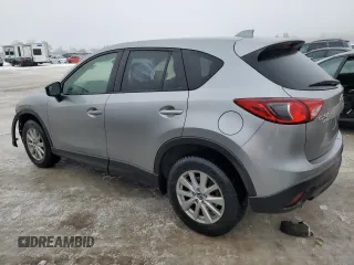 2015 Mazda CX-5 Sport with VIN JM3KE4BEXF0499688, listed as a Copart auction lot 88988095 with 258,460 mi miles and Salvage title. Bid and sale history available at DreamBid. Image 2.