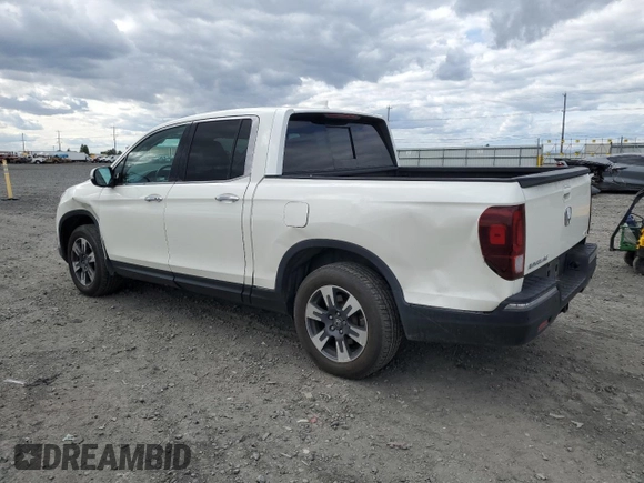 2019 Honda Ridgeline RTL-E with VIN 5FPYK3F74KB039057, listed as a Copart auction lot 57350525 with 105,102 mi miles and Salvage title. Bid and sale history available at DreamBid. Image 2.
