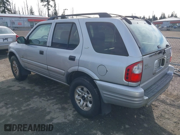 2002 Isuzu Rodeo z VIN 4S2DM58W924321403, wystawiony jako IAAI lot #41503572 z przebiegiem 235 072 mil mil oraz . Historia ofert i sprzedaży dostępna na DreamBid. Obrazek 3.