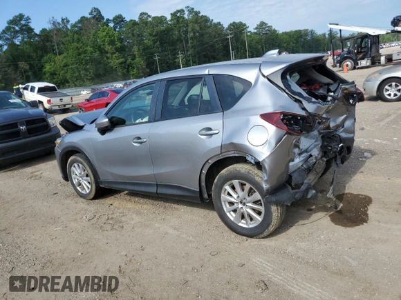2015 Mazda CX-5 Touring with VIN JM3KE2CY7F0435914, listed as a Copart auction lot 61885704 with 0 mi miles and Salvage Title. Bid and sale history available at carsss.com. Image 2.