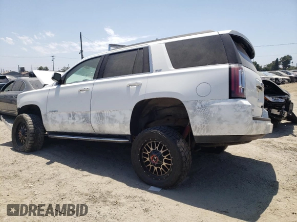 2020 GMC Yukon SLT with VIN 1GKS2BKC1LR268078, listed as a Copart auction lot 63642494 with 63,584 mi miles and Salvage Title. Bid and sale history available at carsss.com. Image 2.