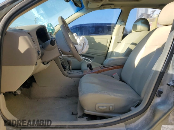 2002 Infiniti I35 Luxury with VIN JNKDA31A62T014458, listed as a Copart auction lot 77677764 with 169,007 mi miles and Salvage Title. Bid and sale history available at DreamBid. Image 7.