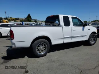 2002 Ford F-150 XL with VIN 1FTRX17212NA28461, listed as a Copart auction lot 63710665 with 185,460 mi miles and Salvage title. Bid and sale history available at DreamBid. Image 3.