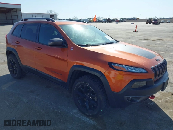 2016 Jeep Cherokee Trailhawk with VIN 1C4PJMBBXGW251682, listed as a IAAI auction lot 41973696 with 100,411 mi miles. Bid and sale history available at carsss.com. Image 1.