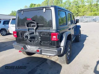 2022 Jeep Wrangler Unlimited Rubicon with VIN 1C4HJXFNXNW149063, listed as a IAAI auction lot 42130171 with 33,961 mi miles and . Bid and sale history available at DreamBid. Image 4.
