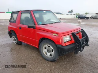 1996 Chevrolet Tracker z VIN 2CNBE1865T6946093, wystawiony jako IAAI lot #42120266 z przebiegiem 180 736 mil mil oraz . Historia ofert i sprzedaży dostępna na DreamBid. Obrazek 1.