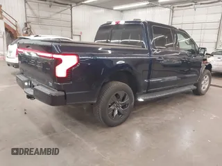 2023 Ford F-150 Lightning Pro with VIN 1FTVW1EL4PWG22900, listed as a IAAI auction lot 42139391 with 6,569 mi miles and . Bid and sale history available at DreamBid. Image 4.